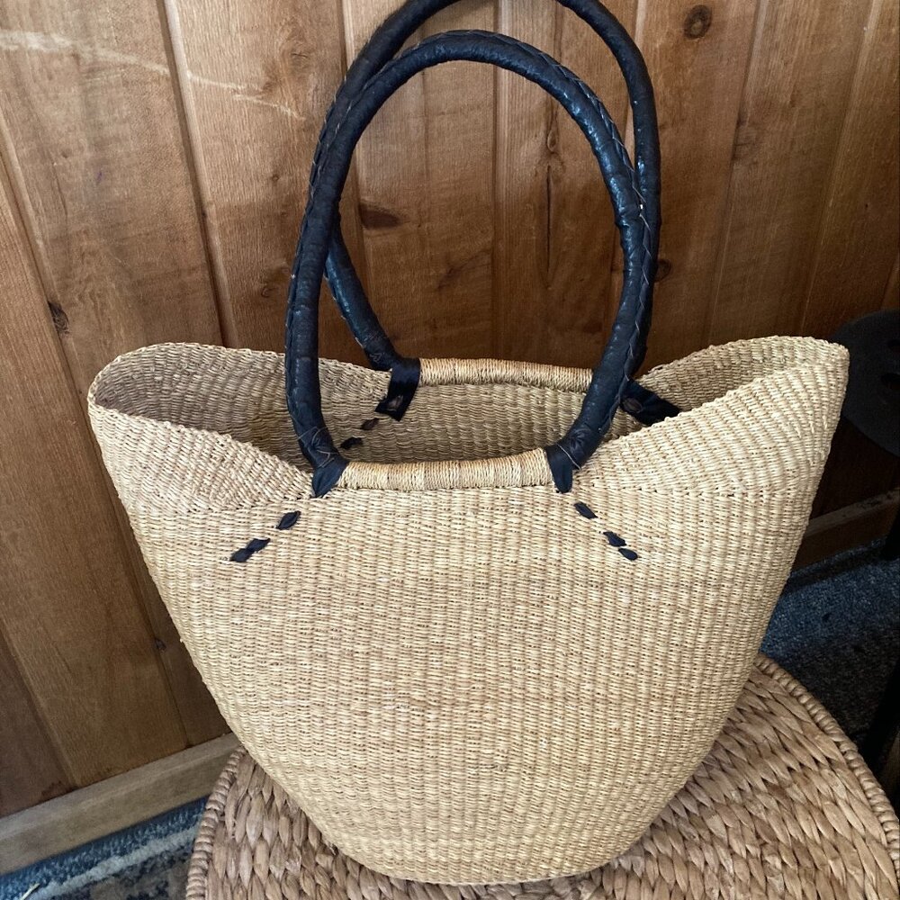 Handwoven bag with black leather strap